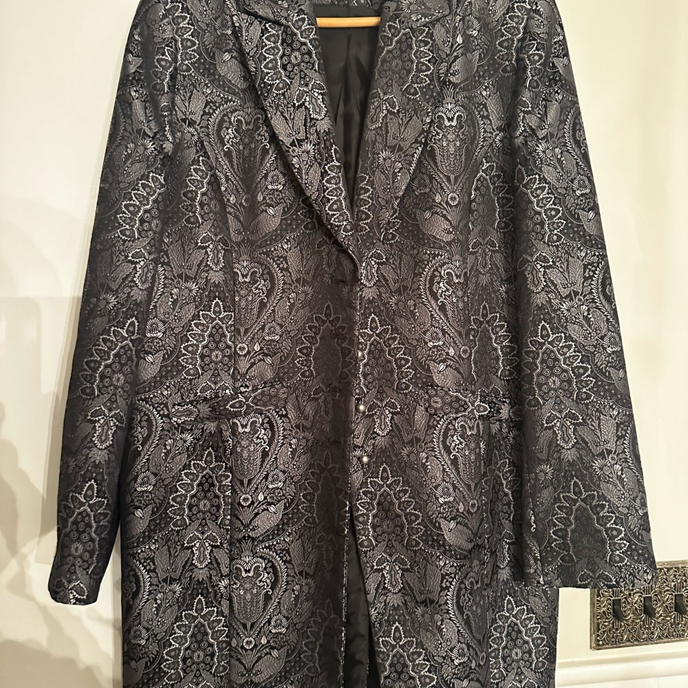 New never won jacket black and silver.